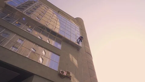 Windows washing skyscraper mountain climber Stock Footage 86255308