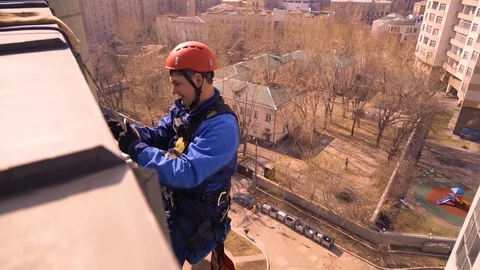 Windows washing skyscraper mountain climber Stock Footage 86255357