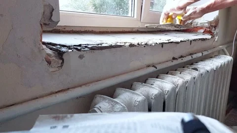 Windowsill Repair with Spatula-Smooth Precision Stock Footage 311229020