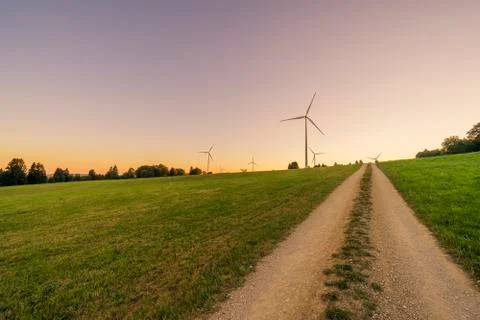 Windpark at sunset and pathway Foto stock