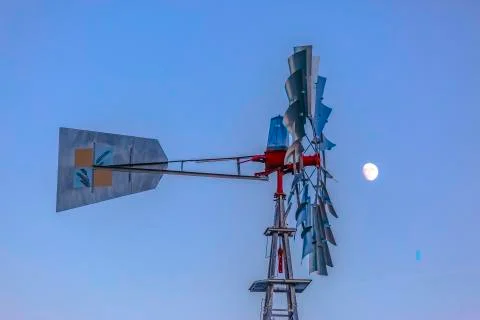 Windpump with multiple blades against sky and moon Stock Photos
