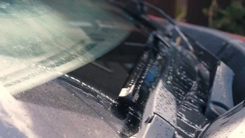 Windscreen wash spraying onto wind shield Stock Footage 341571758