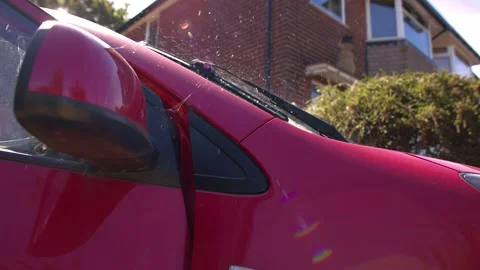 Windscreen wash spraying onto wind shield Stock Footage 344014939