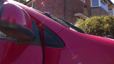 Windscreen wash spraying onto wind shield Stock Footage 344014944