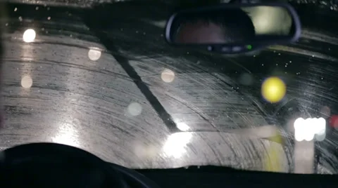 Windscreen wipers are cleaning windshield Stock Footage 32464483
