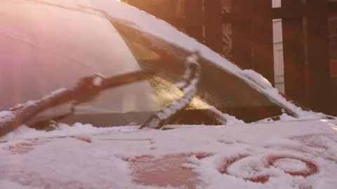 Windscreen wipers clear car windsheild from snow Stock Footage 327222297