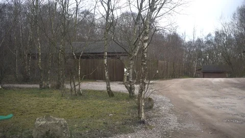 Windscreen wipers clearing windscreen, cabins in background, 4k Stock Footage 86472278