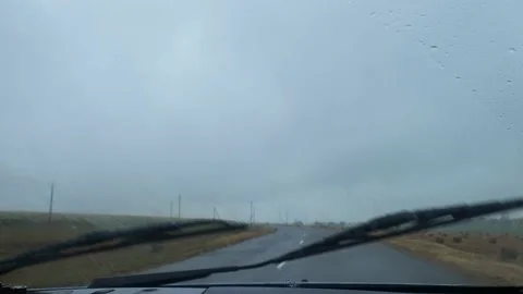 Windshield of a car in the rain. view from the car on a rainy day Stock Footage 218299802