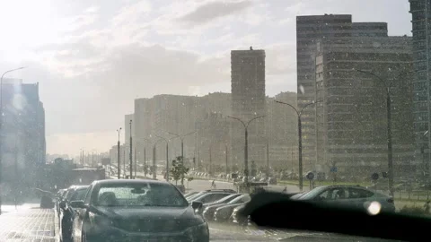 Windshield offers view of rain-drenched city wipers battling downpour heavy rain Stock Footage 280120166