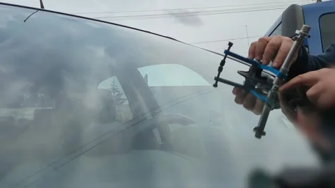 Windshield Repair in 4K, Injecting Adhesive into Crack, Car Glass Fix, Professio Stock Footage 336560653