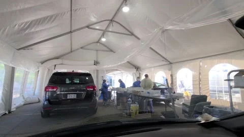 Windshield view of the inside of a testing clinic used by motorists as Video stock 133971697