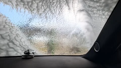 Windshield View From Inside Vehicle During Automated Soap Car Wash 写真素材