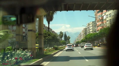 Windshield view from a moving car in the city slow motion Stock Footage 63337920