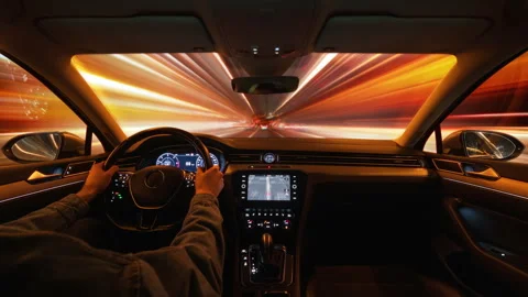 Windshield view timelapse high speed drive in city at night traffic light trails Stock Footage 297718188