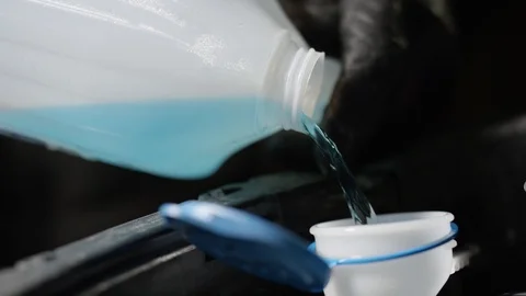 Windshield washer fluid emptying into car slow motion Video stock 85844529