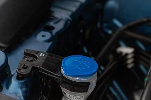 Windshield washer fluid reservoir cap. Windshield washer liquid cap inside a  Stock Photos