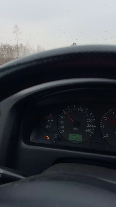 Windshield wiper clearing wet highway ahead, blurred roadside trees and Stock Footage 333260350