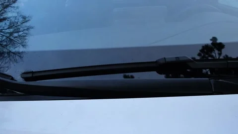 Windshield wiper falling onto car glass surface car maintenance and automot.. Stock Footage 330976523