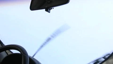 A windshield wiper works on a 20 plus years old car on a white background for cu Vídeo Stock 254600682