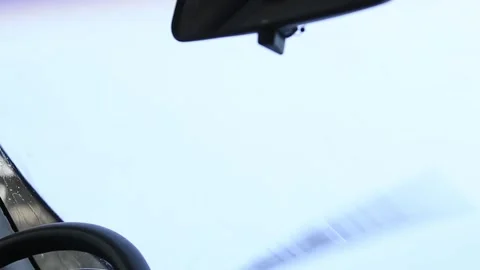 A windshield wiper works on a 20 plus years old car on a white background for cu Stock Footage 254602181