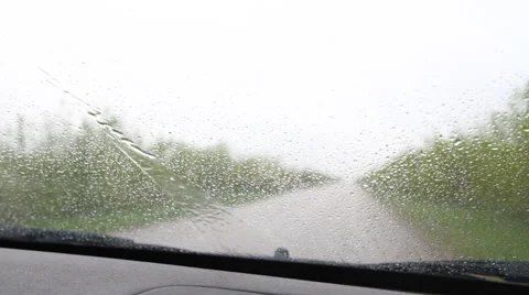 Windshield wipers clean the glass from rain drops Stock Footage 50128598