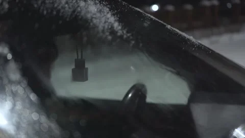 Windshield wipers clean up windshield from snow Stock Footage 147007910