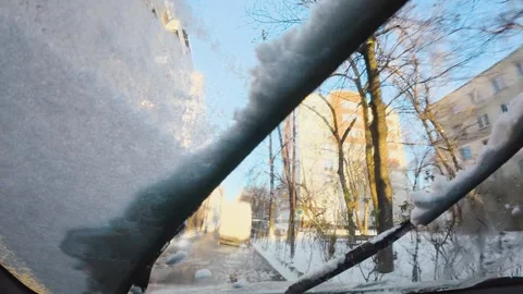 Windshield Wipers Clearing Snow From Car Window, Interior View Stock Footage 327077587
