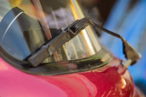 Windshield wipers help wipe the rainwater. While driving cars in the rainy ti Stock Photos
