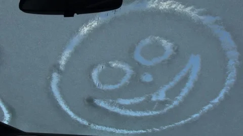 Windshield wipers remove snow on a windshield Stock Footage 147538713