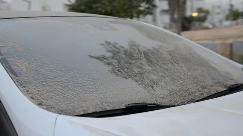 Windshield wipers on the windshield of a car under a layer of dust Stock Footage 129051821