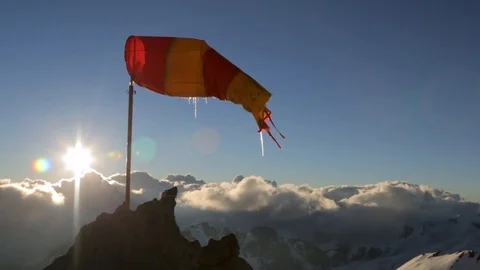 Windsock above snowy mountain range on Aconcagua in Argentina Video stock 90878979