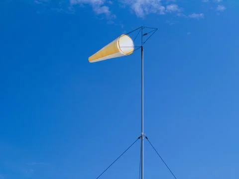 Windsock against a blue sky with clouds Stock Photos