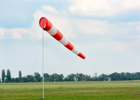 Windsock against cloudy sky. Stock Photos
