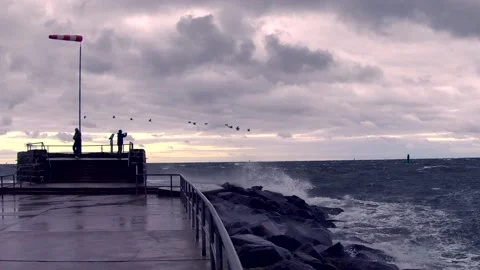 Windsock on baltic sea - storm, ocean, sprays, waves, clouds, wind - real time Stock Footage 141149175