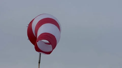 Windsock with cloudy sky in the background. Video stock 143897431