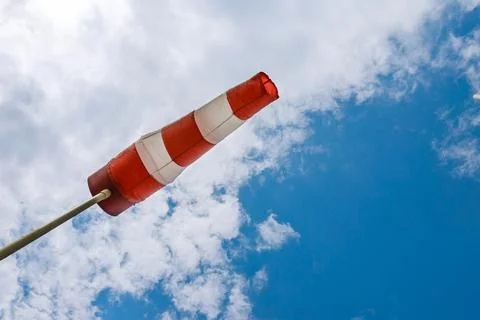 Windsock flag. Windsock indicator of wind on runway airport Stock Photos