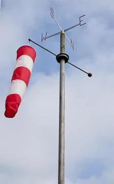 Windsock floating in the wind indicating wind strength and direction. Stock-Fotos