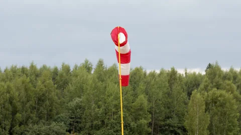 Windsock hangs without wind on pole at airport, not windy weather. gray-blue Stock Footage 206049630