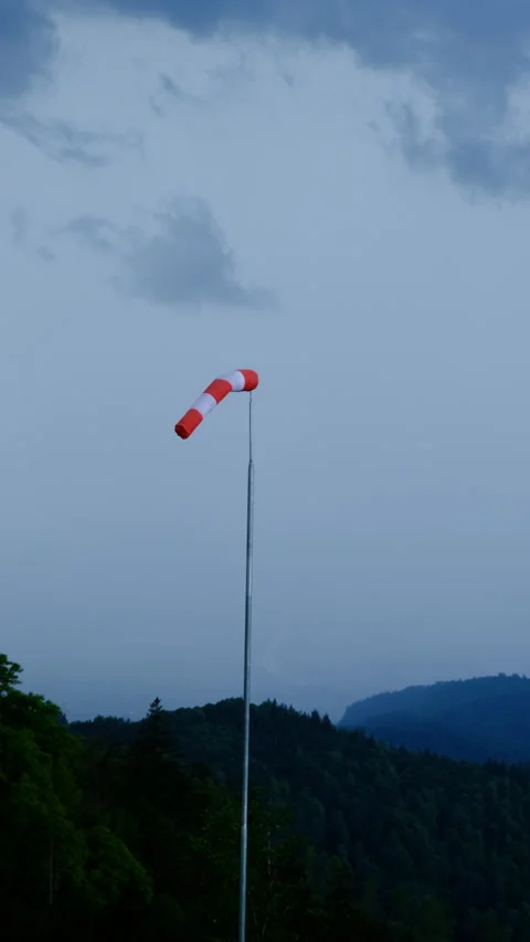 Windsock in the mountains shows a wind of storm Stock Footage 278116018