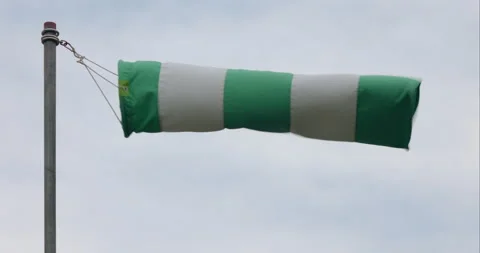 Windsock swaying in the wind at the construction site Stock Footage 165519685