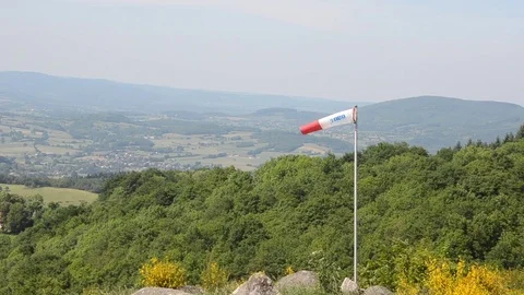 Windsock in the wind on a green hill Video stock 77849380