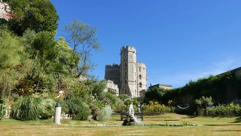 Windsor Castle. View from Moat Garden of Edward IV Tower over pond and fountain Stock Footage 99875946