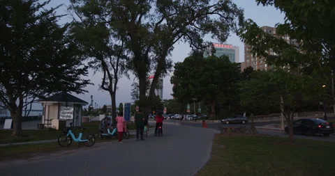 WINDSOR, ONTARIO, CANADA - MAY 30 2023: People walking on the Windsor waterfront Stock Footage 250495470