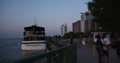 WINDSOR, ONTARIO, CANADA - MAY 30 2023: People walking on Windsor Waterfront Stock Footage 250495534
