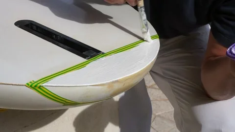 Windsurf board repair Stock Footage 254348170
