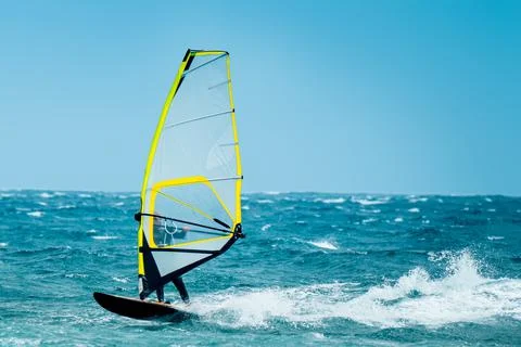 Windsurf riding the waves Stock Photos