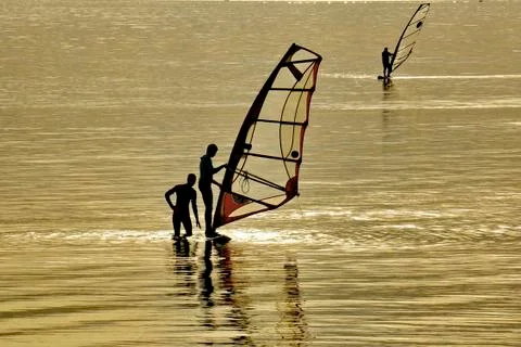 Windsurf training. The teacher explains to the student how to control the sai Stock Photos