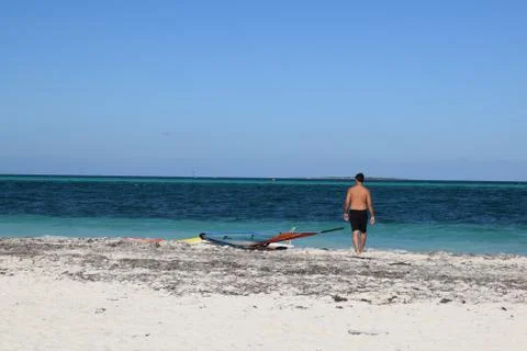 A windsurfer about to start surfing Stock Photos