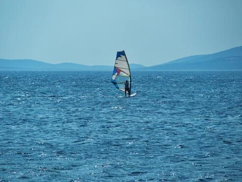 Windsurfer in blue scene Stock Photos
