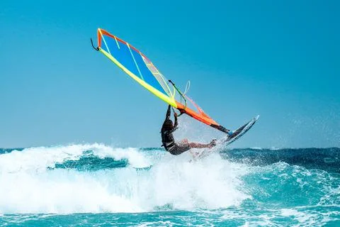 Windsurfer catching wave Stock Photos